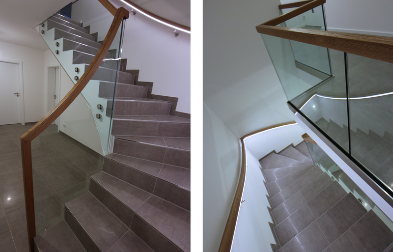 punktgehaltenes Ganzglas-Treppengeländer mit beleuchtetem Handlauf an der Wandseite    Bildquelle: GRÄFE